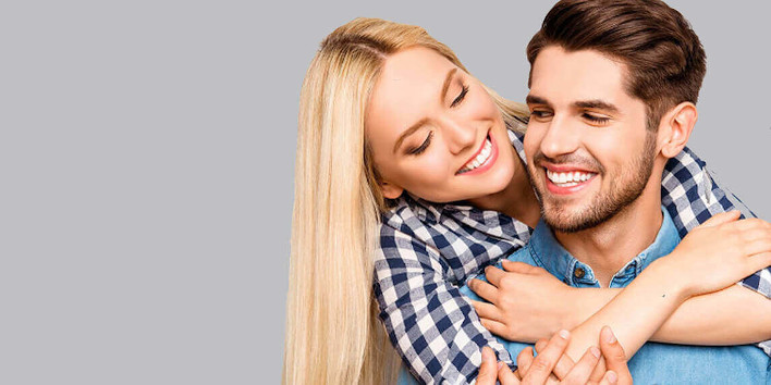 Man & woman, smiling, with healthy hair